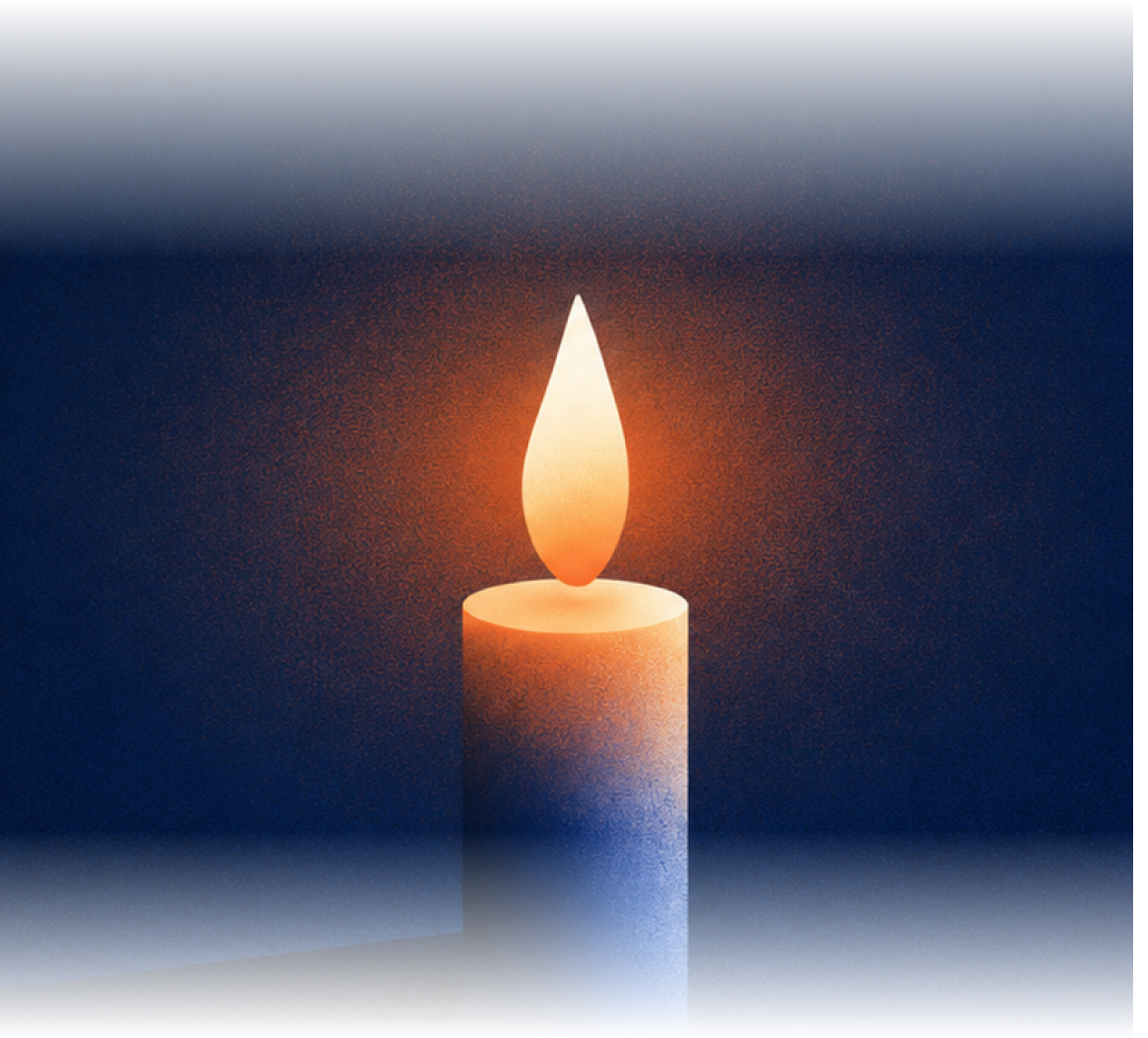 A single lit memorial candle